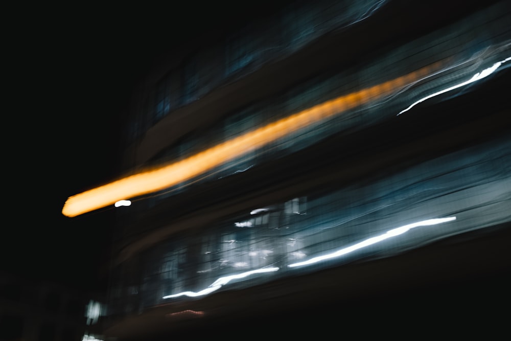 a blurry photo of a bus at night