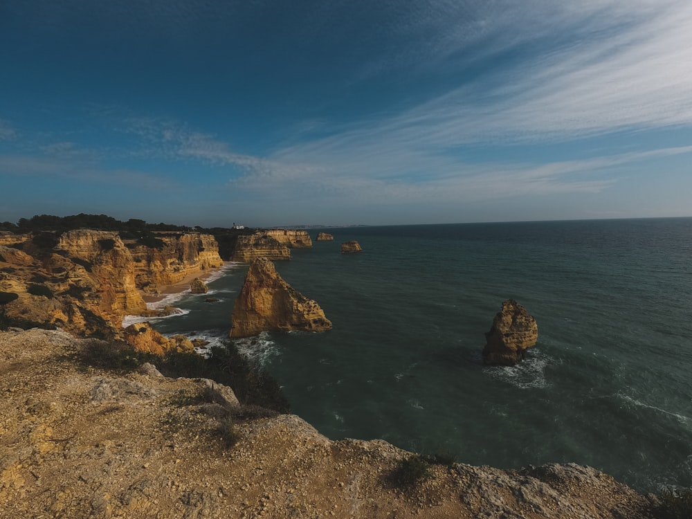 a view of the ocean from the top of a cliff