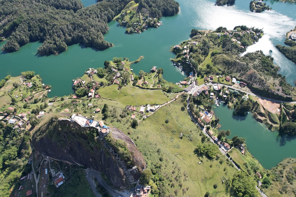 an aerial view of a lake surrounded by trees