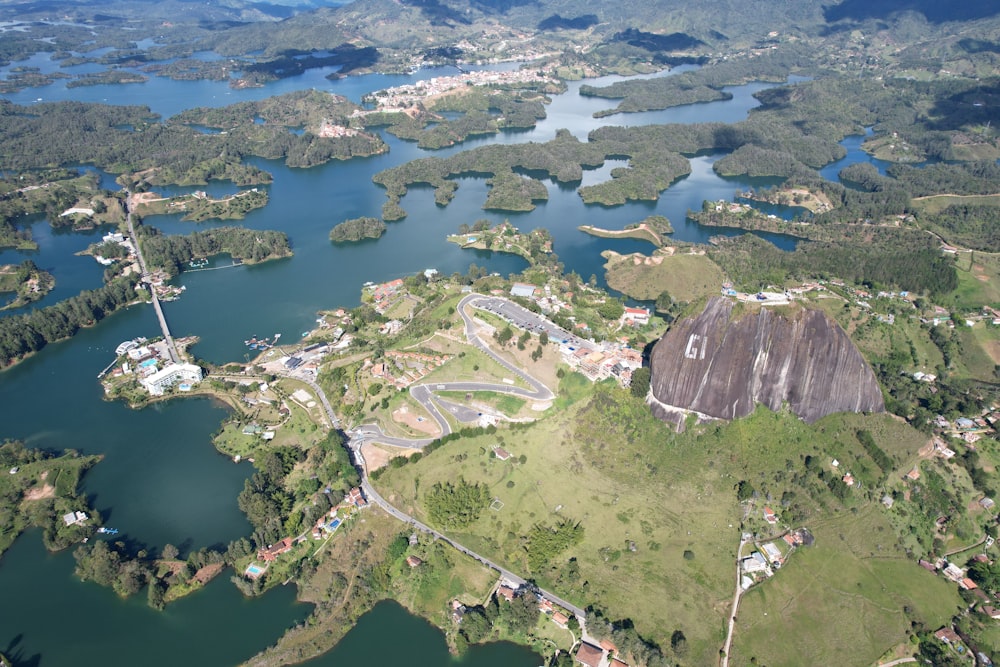 an aerial view of a lake surrounded by land