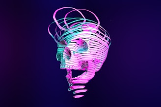 a neon skull is shown against a dark background