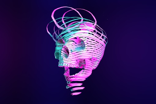 a neon skull is shown against a dark background