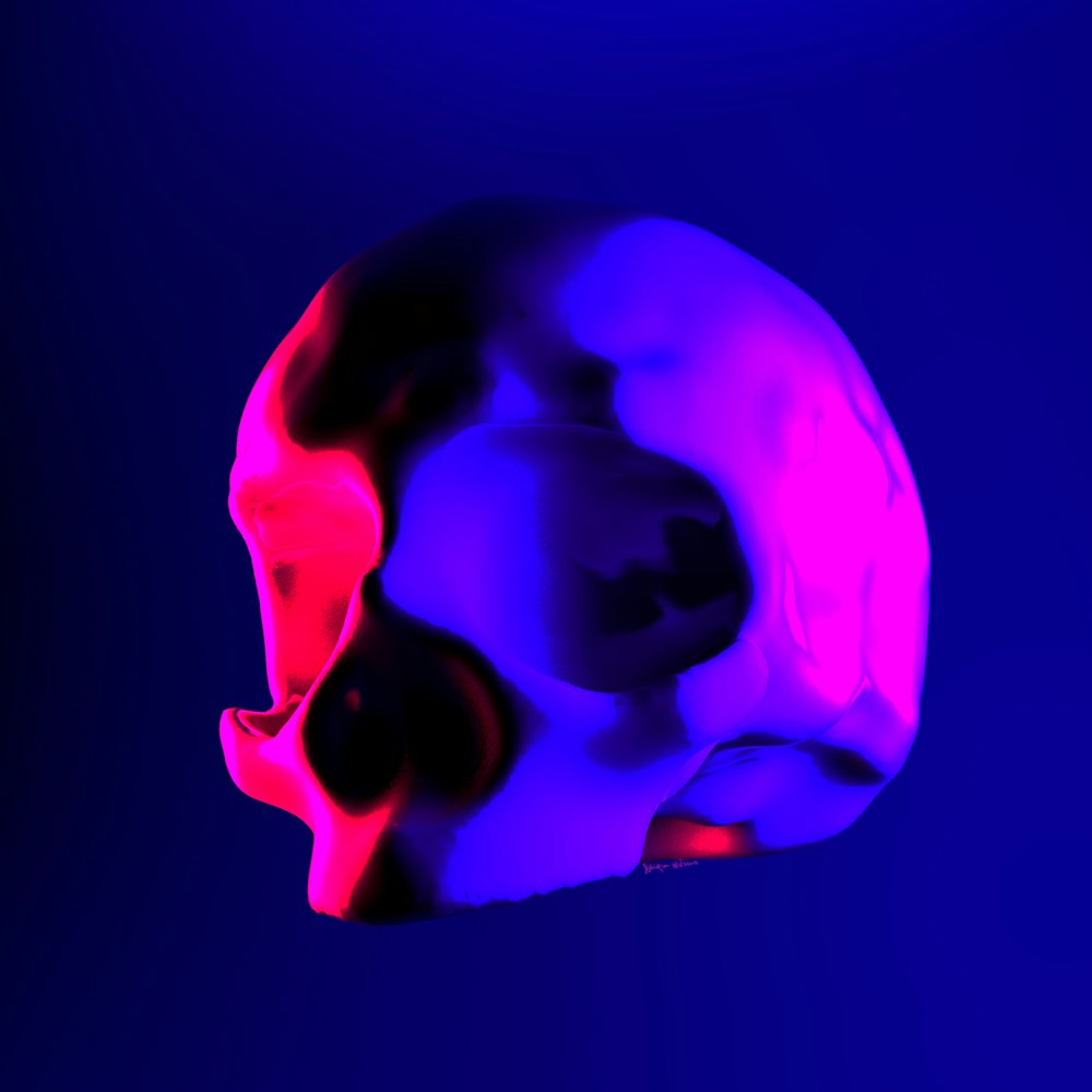 a colorful skull is shown against a blue background