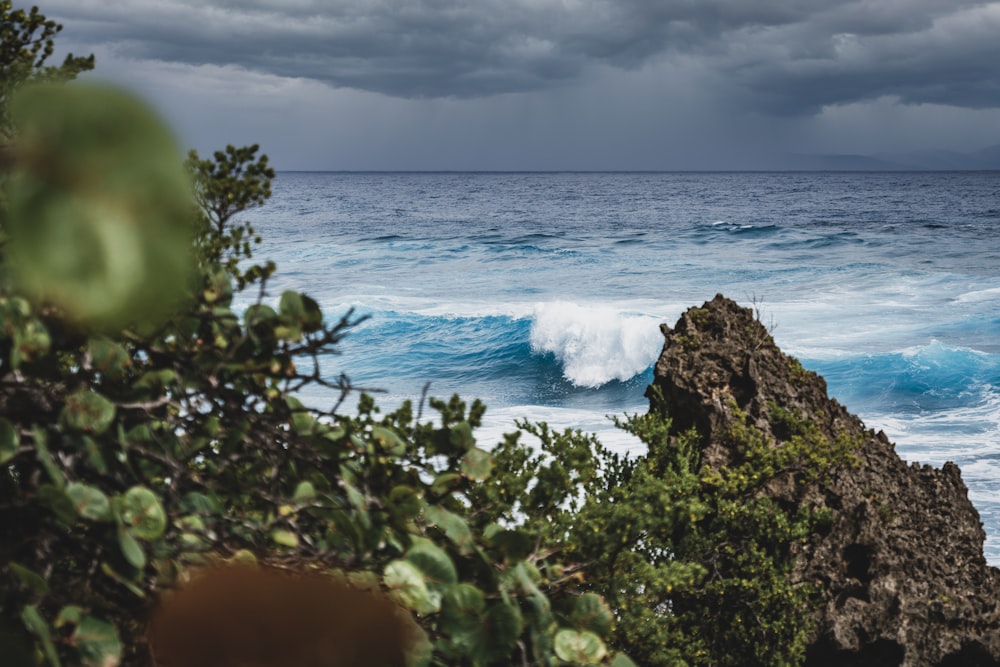 a view of the ocean from a rocky outcropping