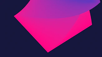 A creative graphic designer working on a vibrant digital project with blue, green, and fuchsia accents.
