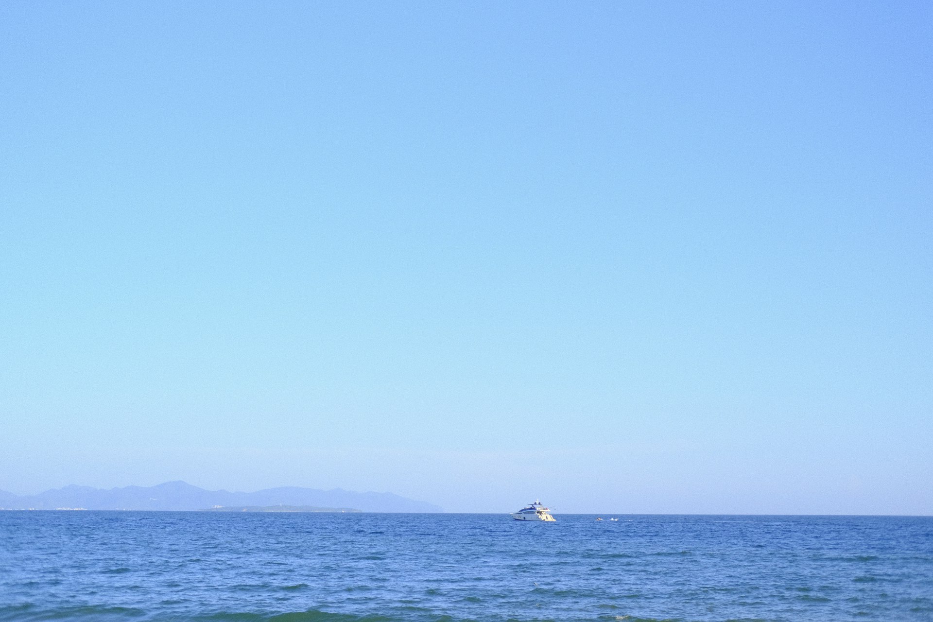 Boat sailing on the ocean in clear weather
