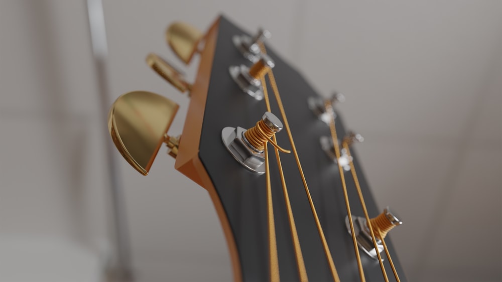 a close up of a guitar's neck and frets
