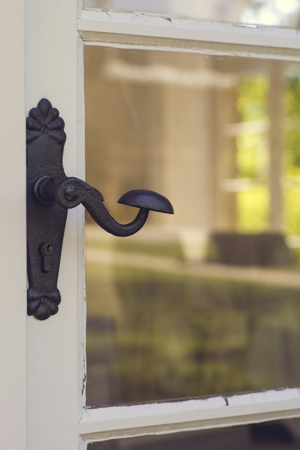 a close up of a door handle on a white door