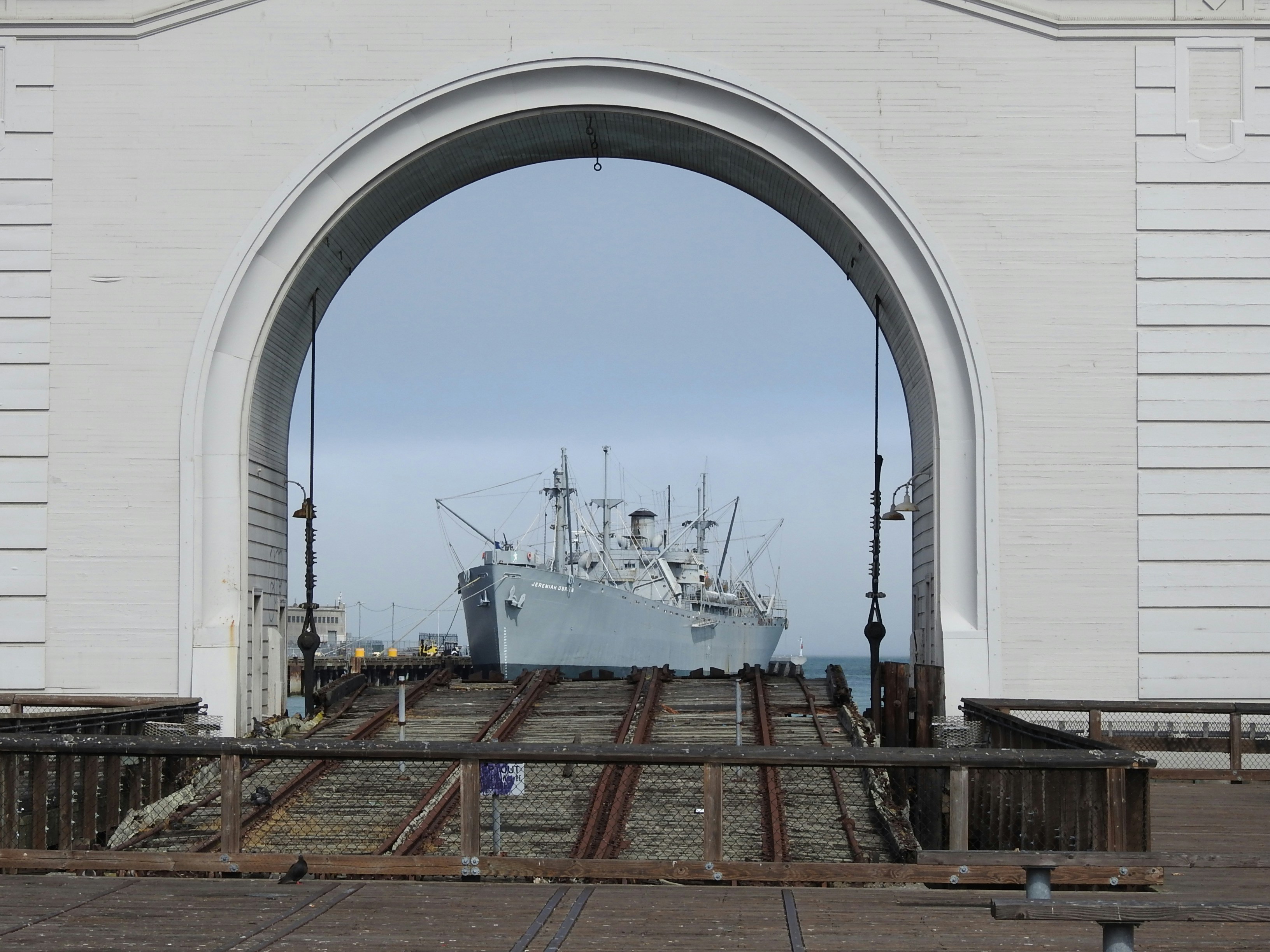 a large boat is docked at a port