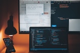 a computer monitor and a laptop on a desk
