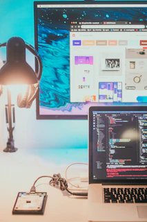 a laptop computer sitting on top of a desk