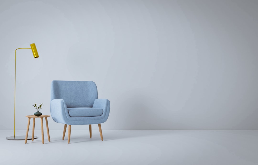 a blue chair and a yellow lamp in a white room, Furniture 3D render.