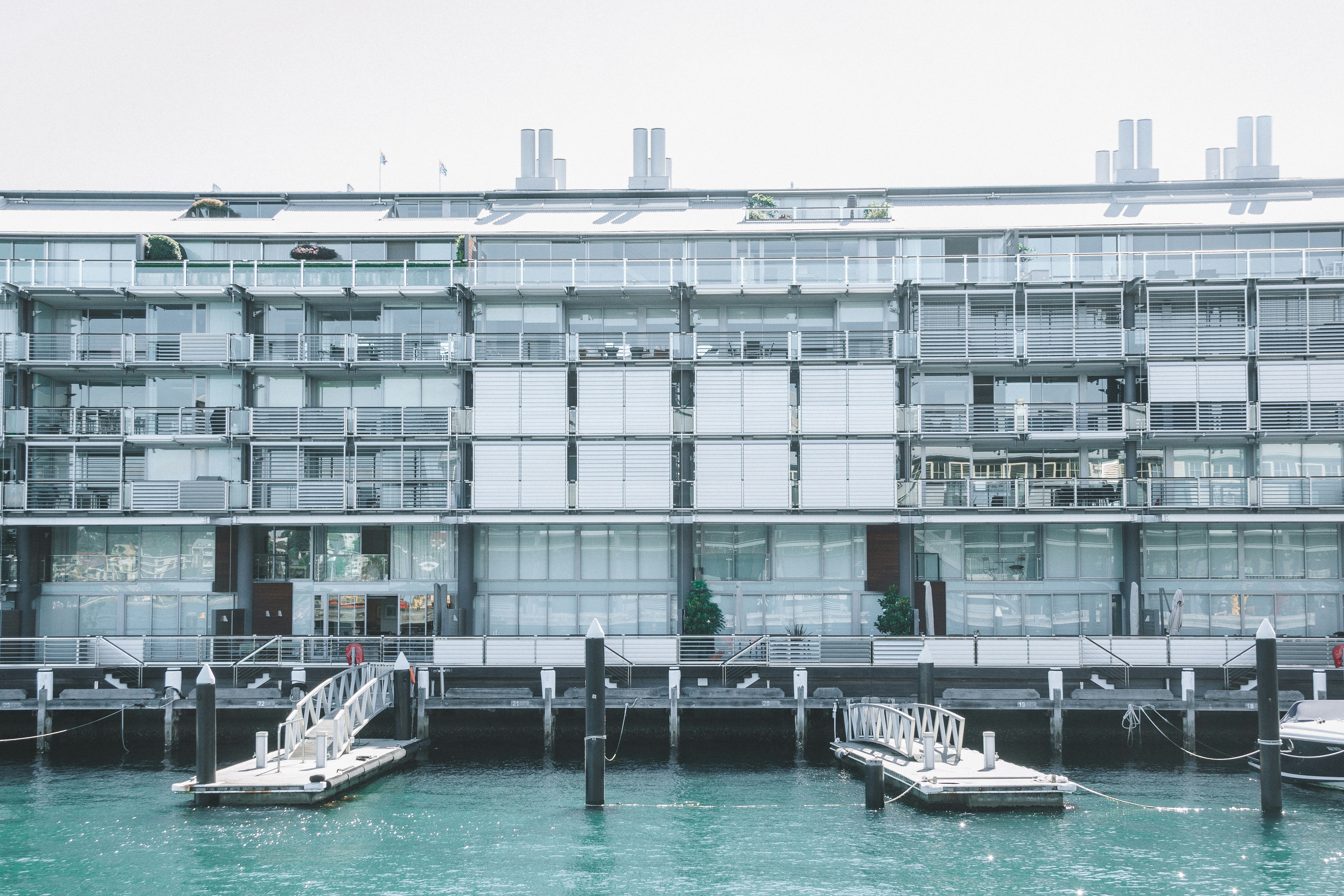 a boat is docked next to a body of water