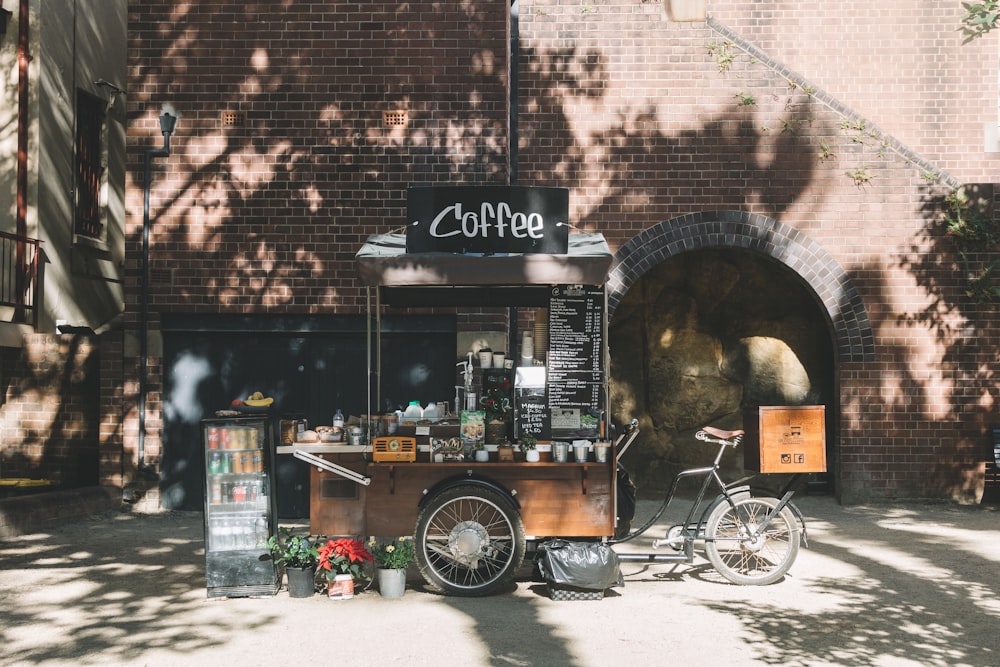 a bike parked in front of a coffee shop