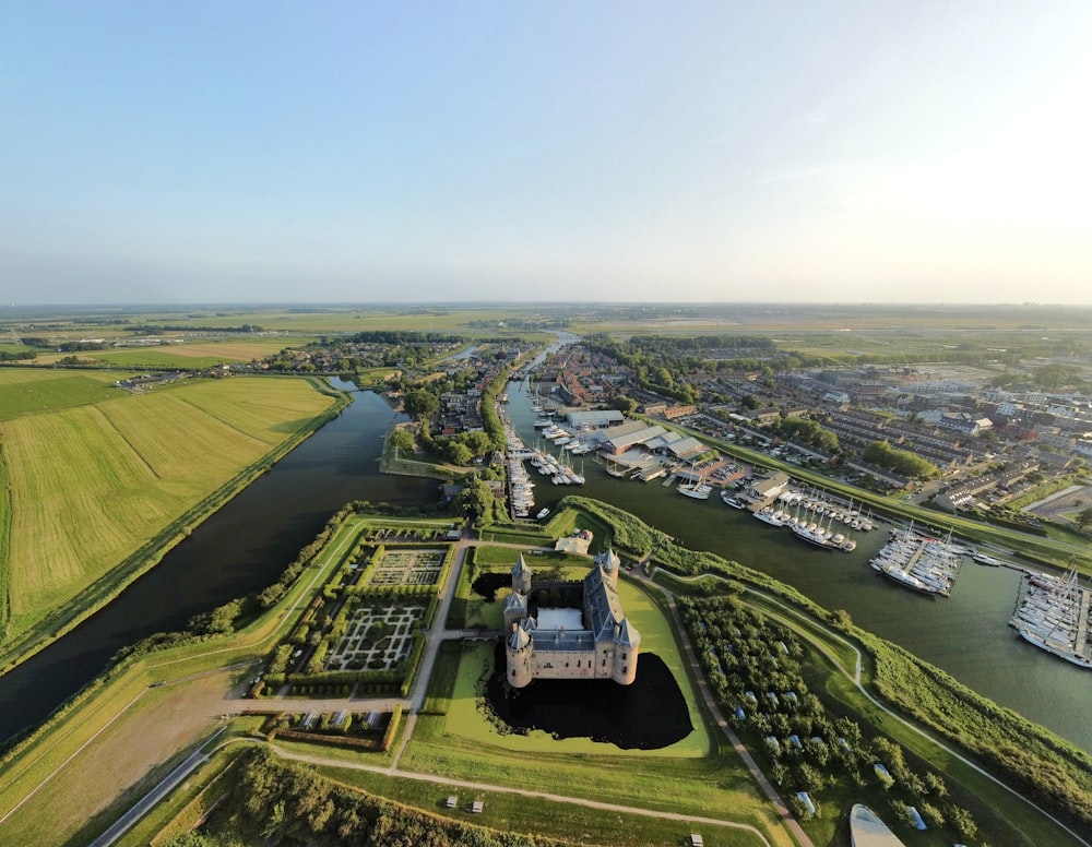 an aerial view of a castle and a river