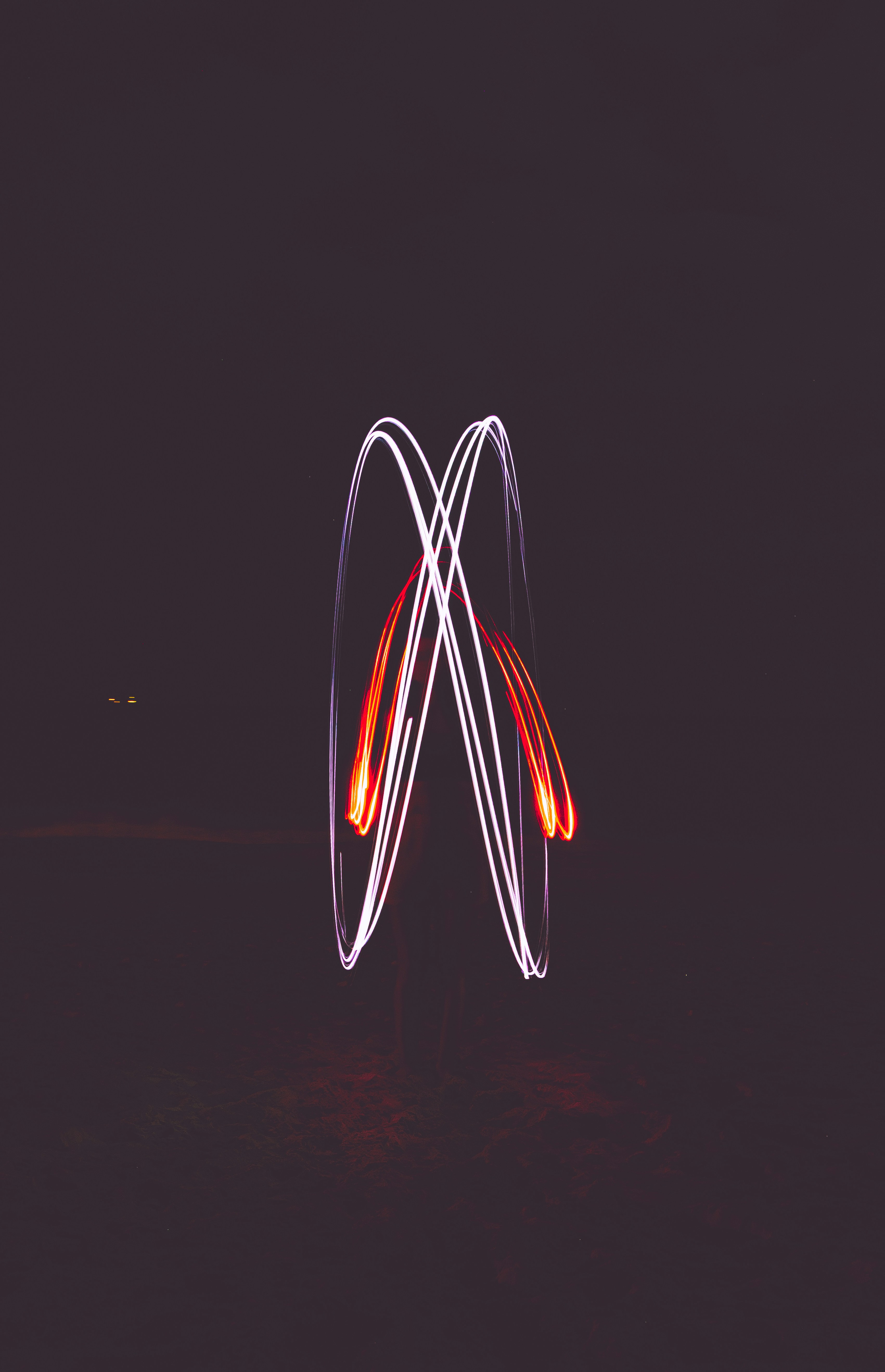 a blurry photo of a firework at night