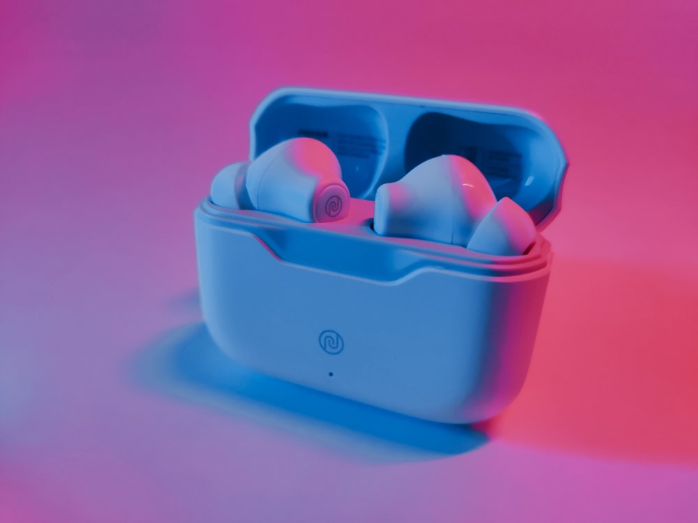 a pair of earbuds in a blue case