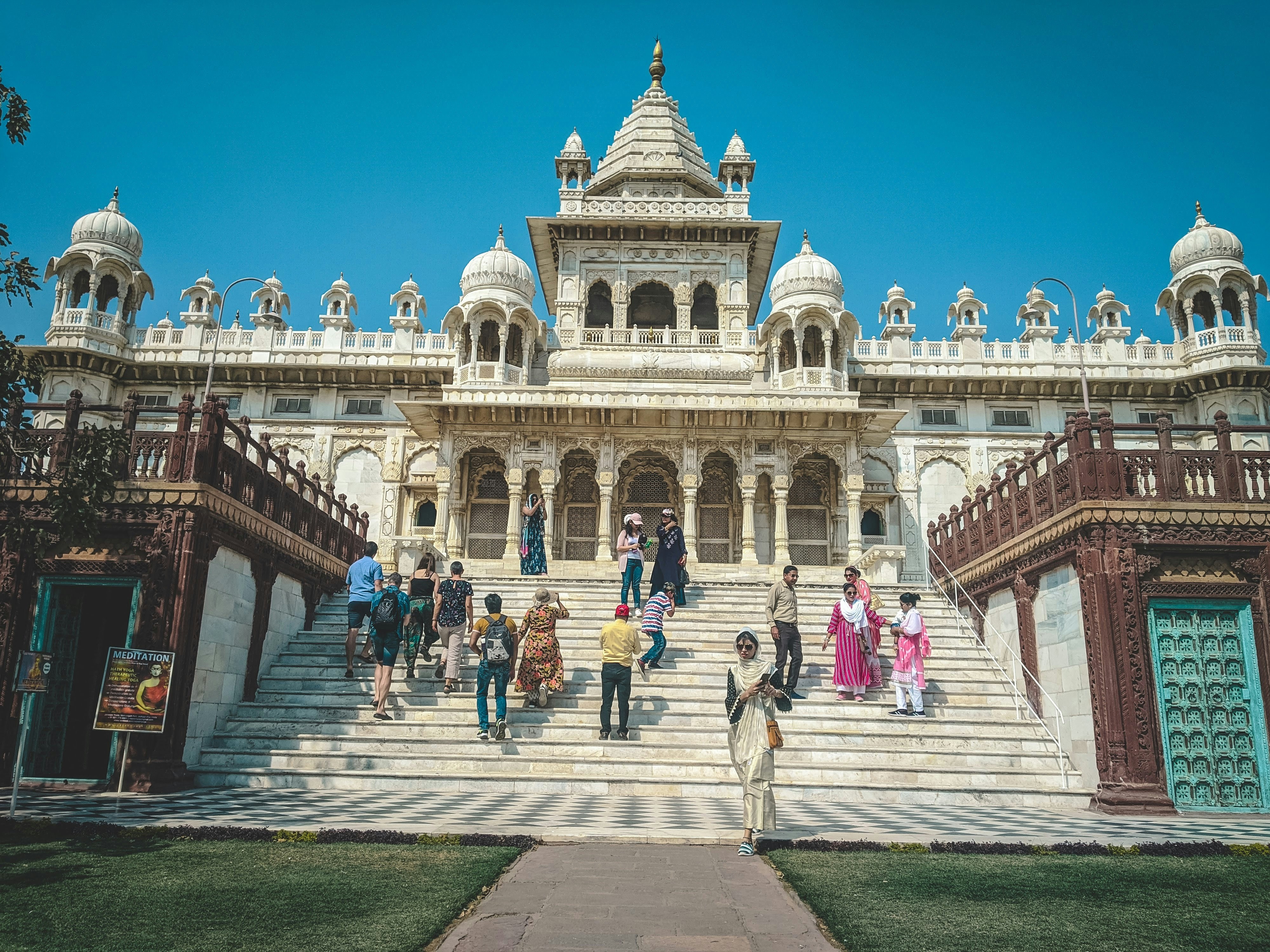 a group of people walking up and down a set of stairs