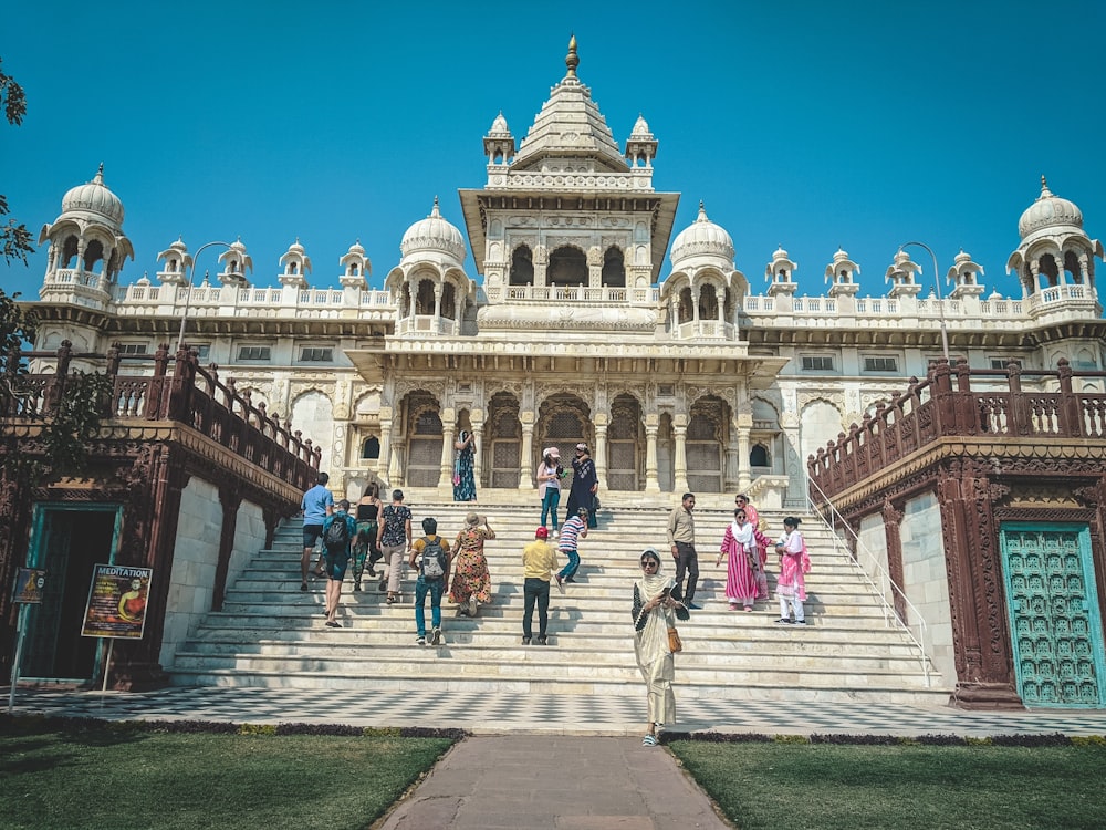 a group of people walking up and down a set of stairs