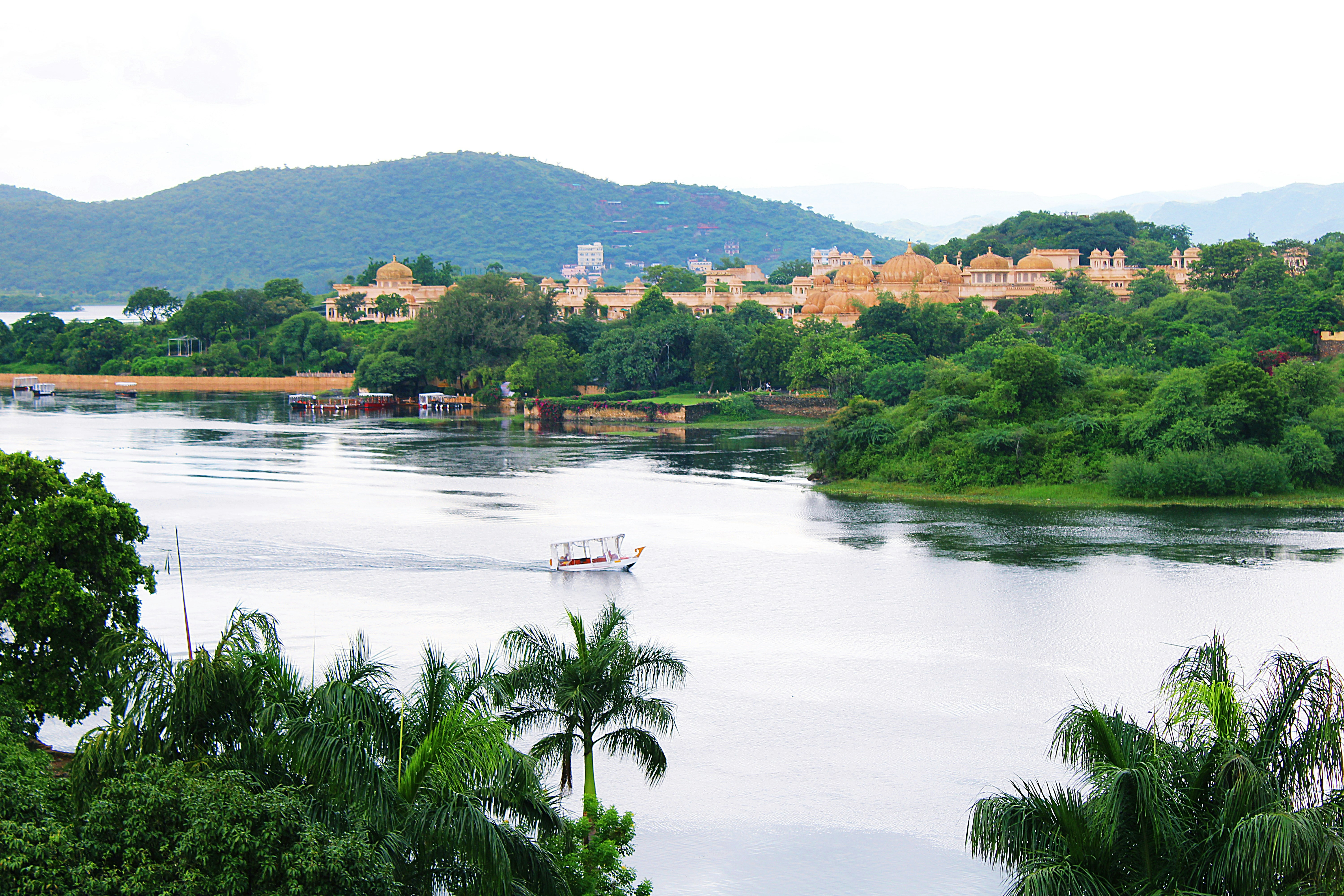 a boat on a river near a city