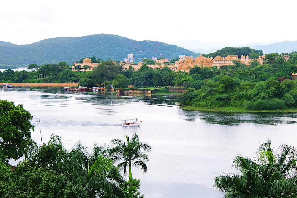 a boat on a river near a city