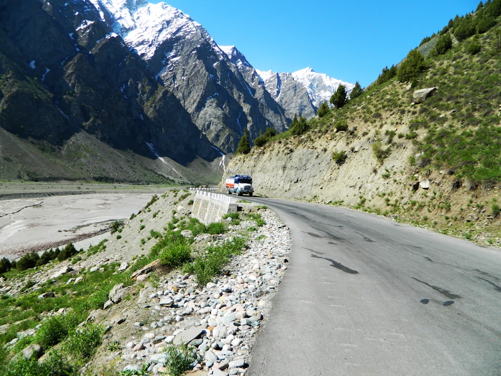 a car is driving down a mountain road