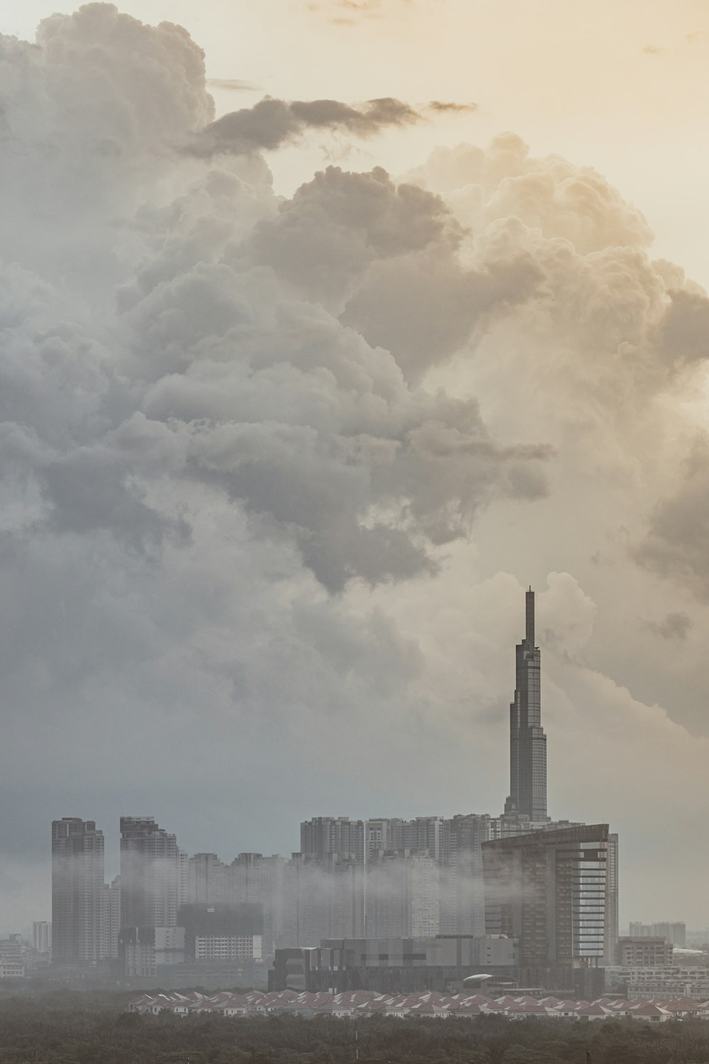 a very tall building with a lot of smoke coming out of it