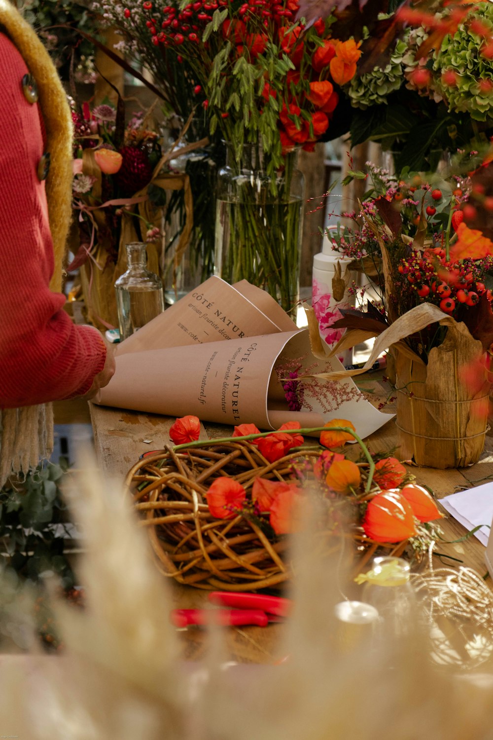 a table topped with lots of different types of flowers