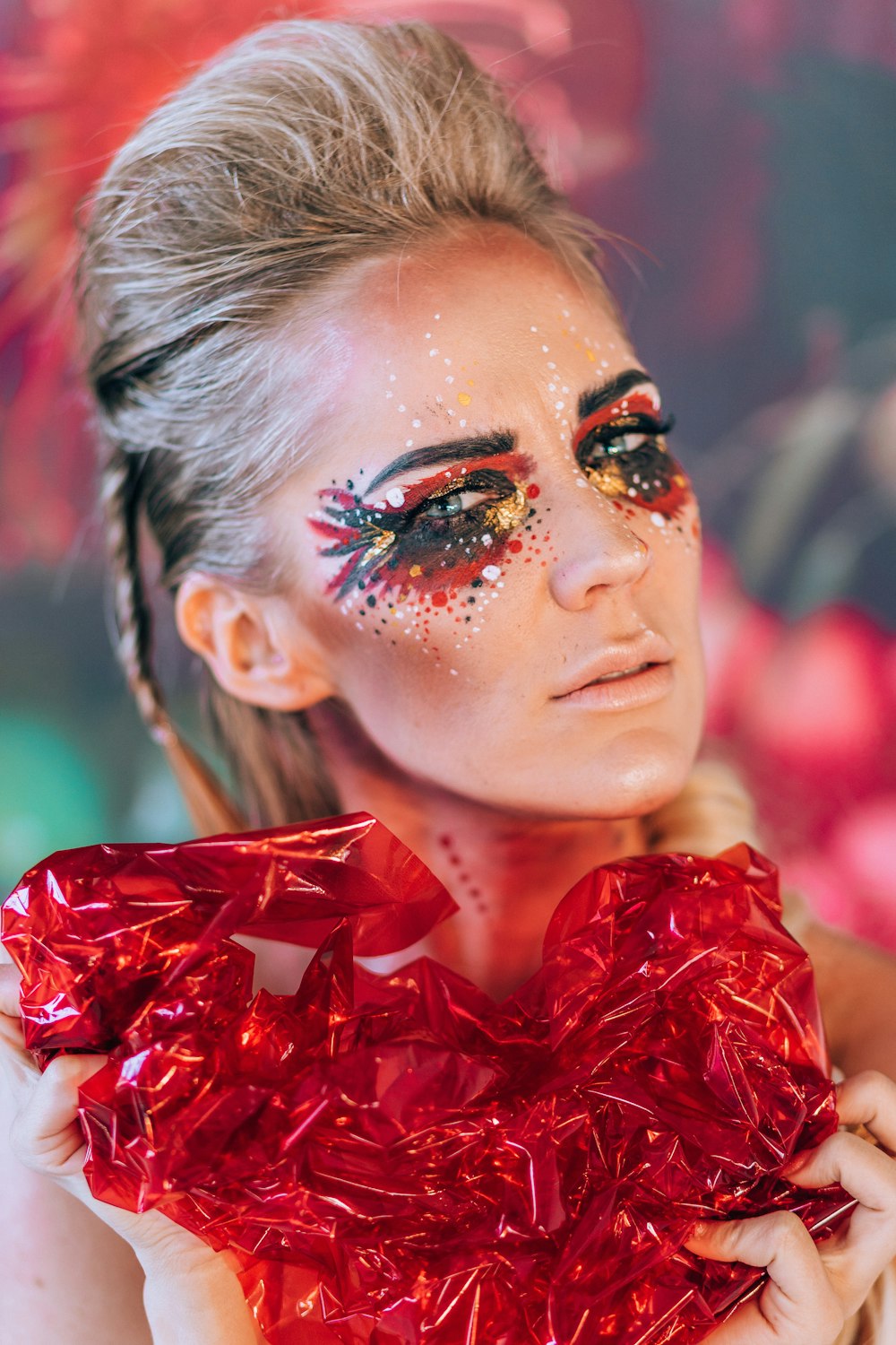 a woman with a red dress and makeup