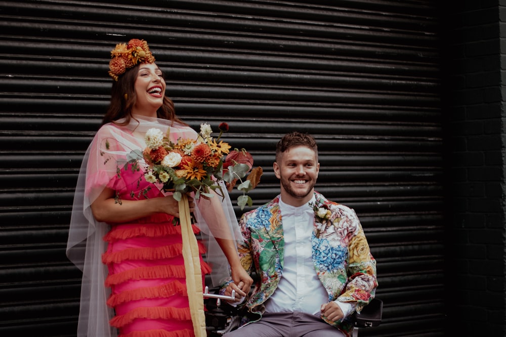 a man and a woman sitting on a motorcycle