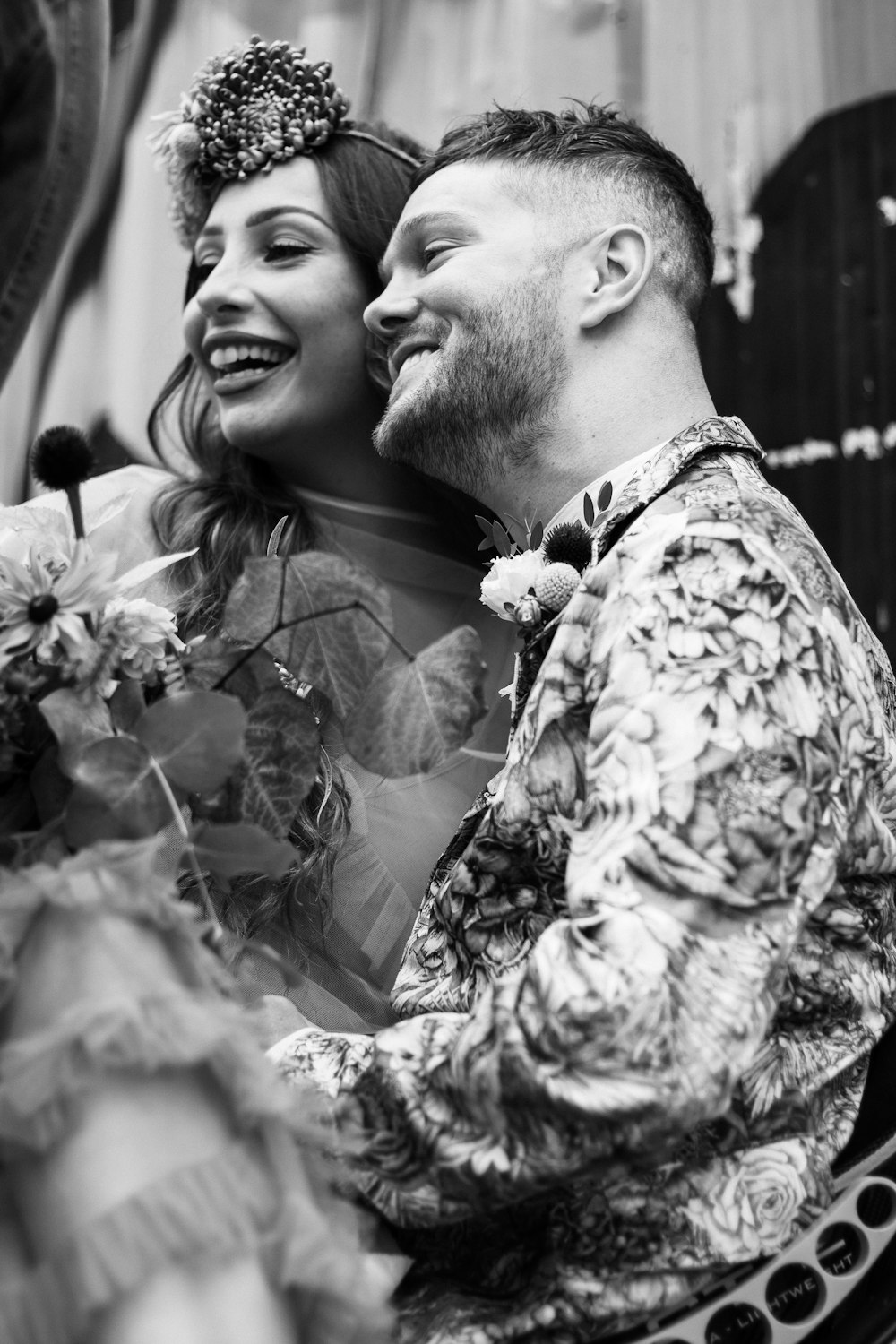 a black and white photo of a bride and groom