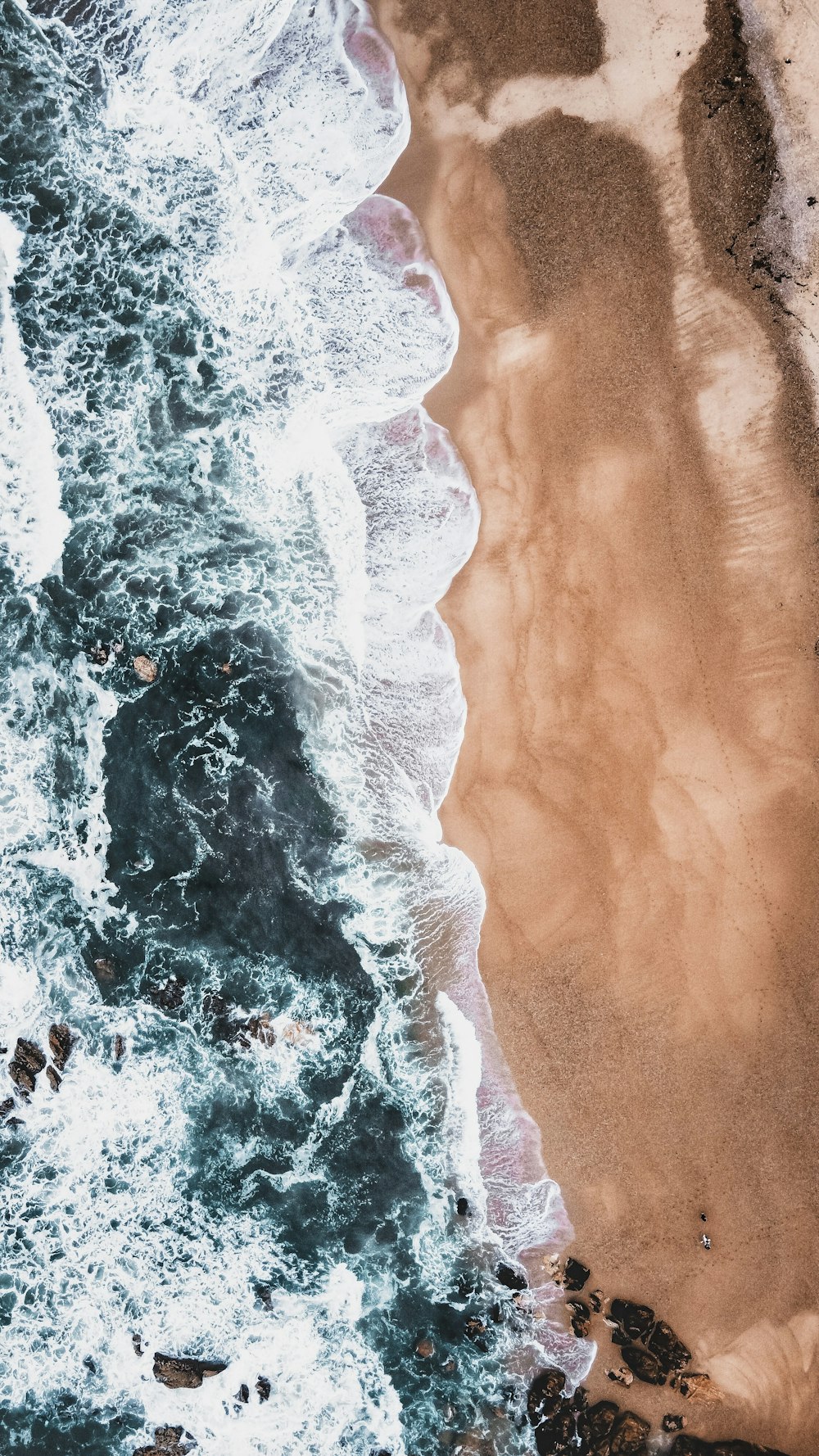 an aerial view of a beach and ocean