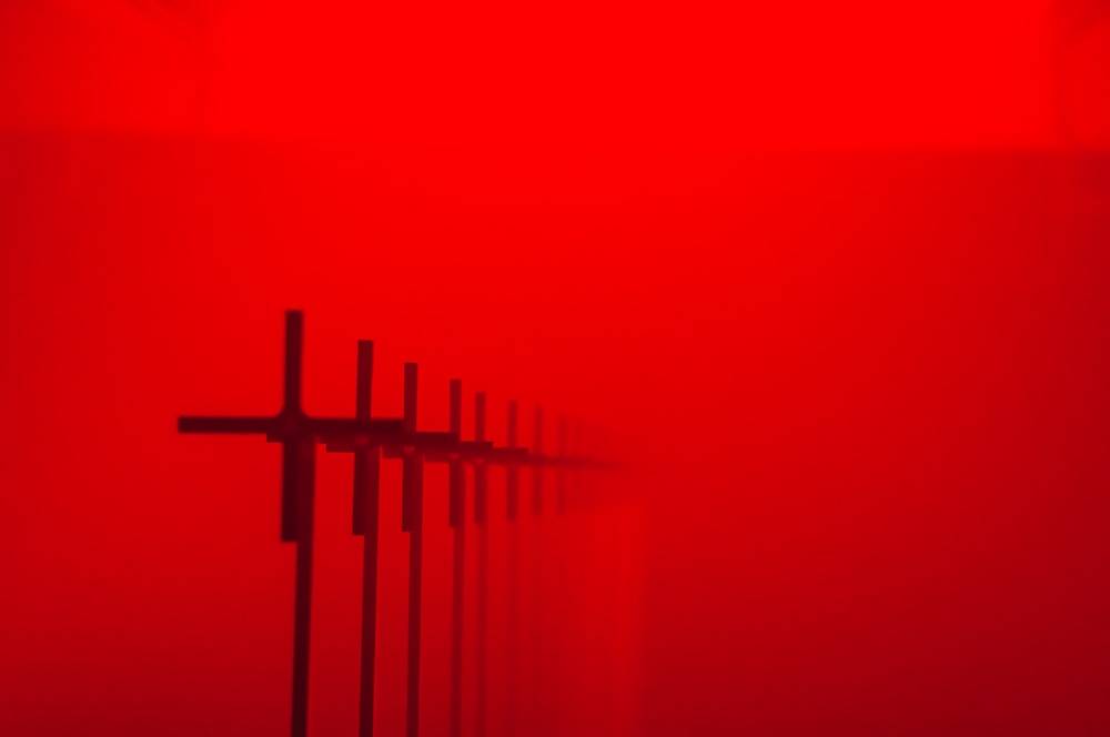 a red wall with a cross on it