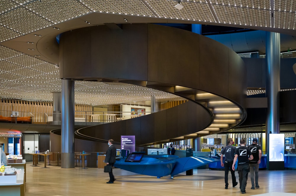 a group of people walking around a building