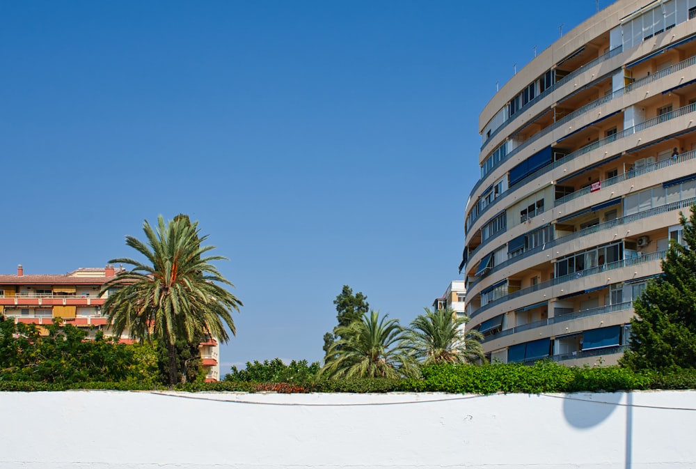 a tall building sitting next to a white wall