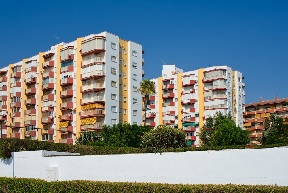 a tall building with many balconies on top of it