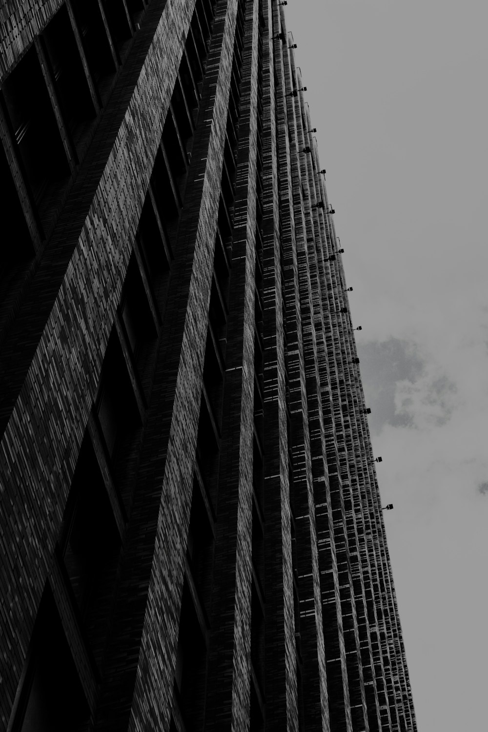 a black and white photo of a tall building