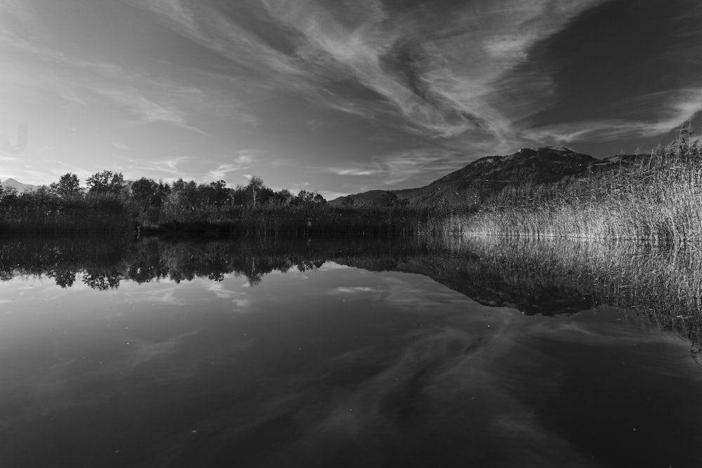 a black and white photo of a lake