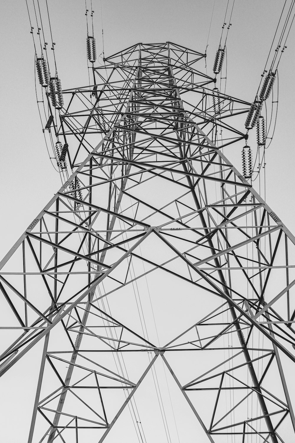 a black and white photo of a high voltage power line