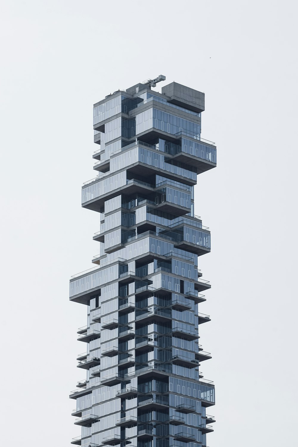 a very tall building with many balconies on it