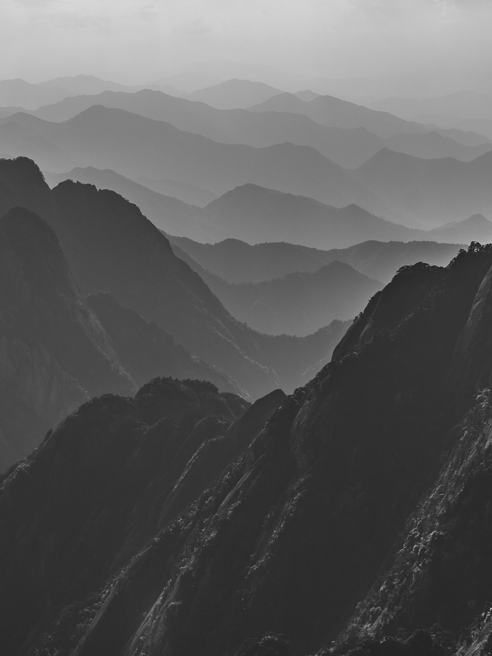 a black and white photo of a mountain range