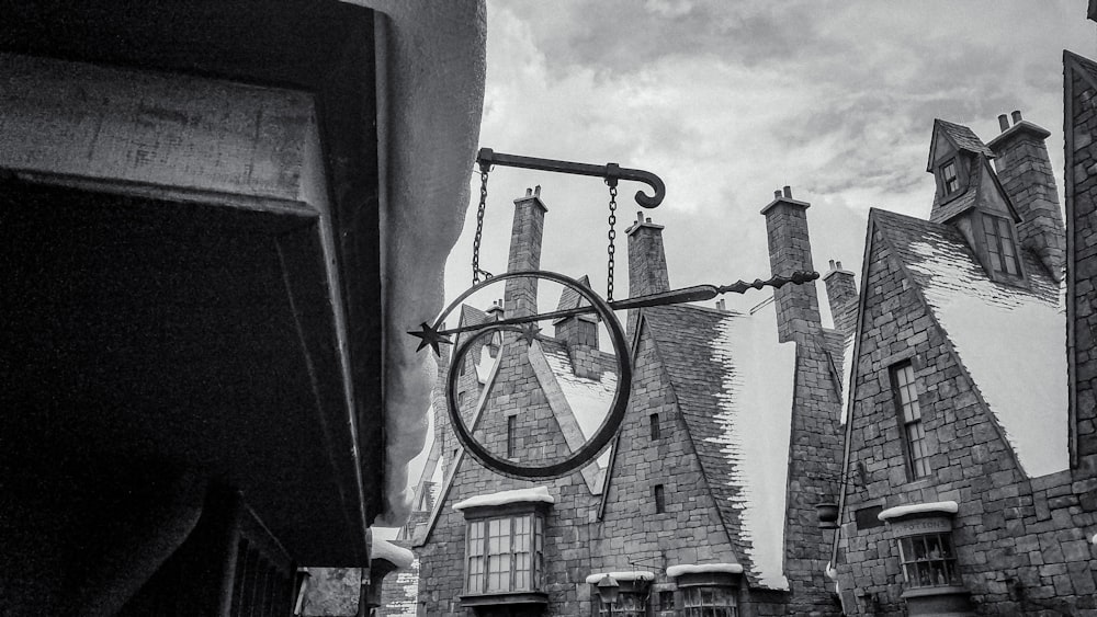 a black and white photo of a building with a clock on it