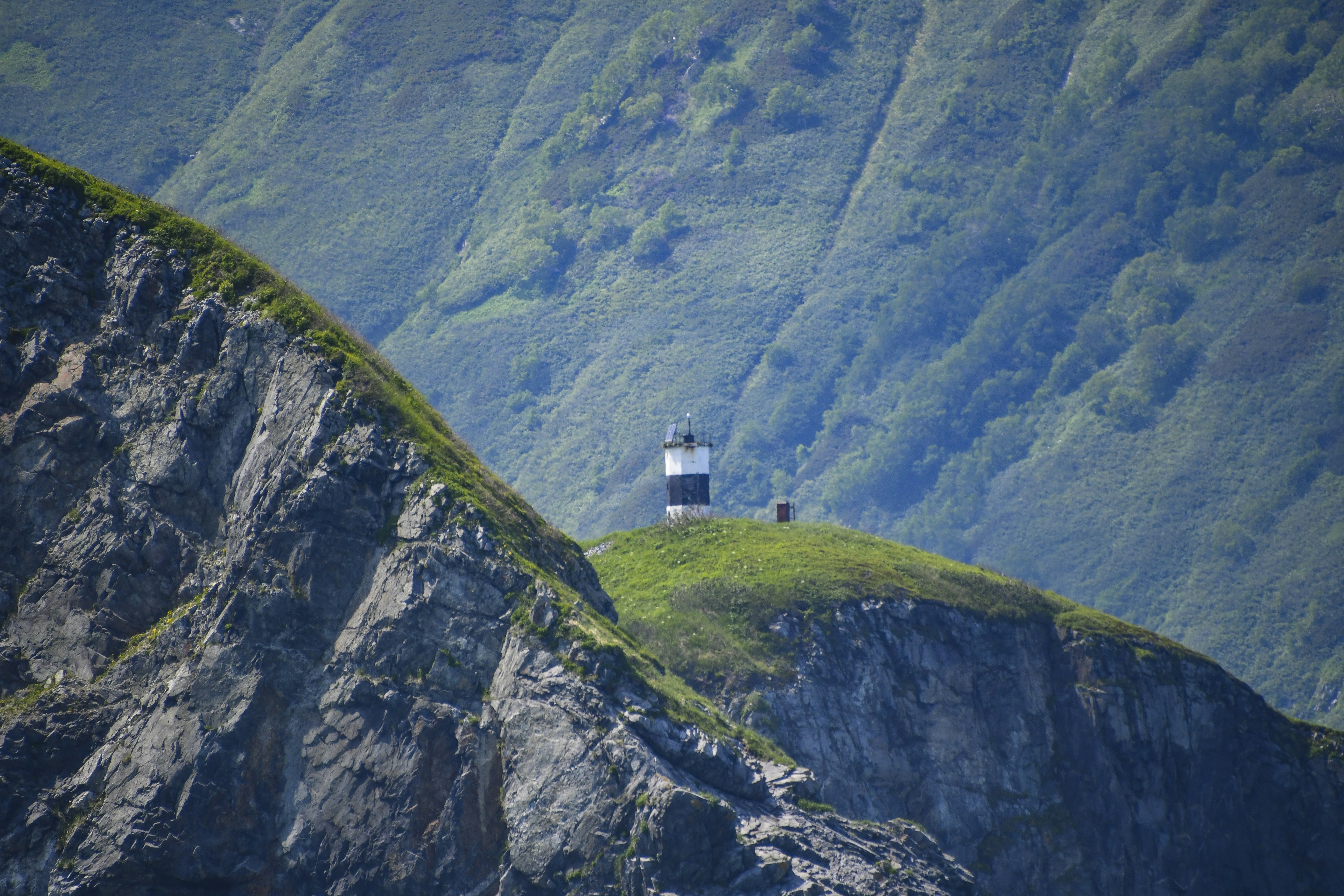 a lighthouse sitting on top of a cliff