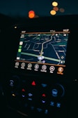 a car dashboard with a gps device in the middle of it