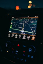 a car dashboard with a gps device in the middle of it