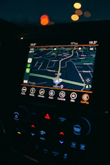 a car dashboard with a gps device in the middle of it