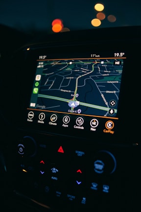 a car dashboard with a gps device in the middle of it
