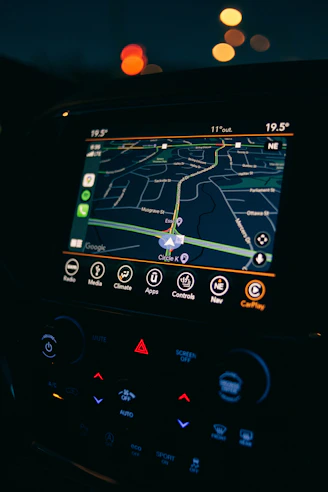 a car dashboard with a gps device in the middle of it