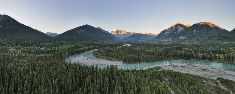 an aerial view of a river and mountains