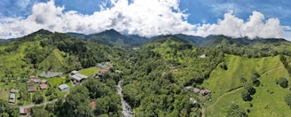 an aerial view of a village surrounded by mountains